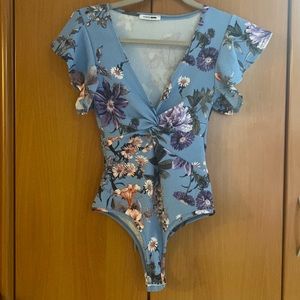 Form fitting floral bodysuit from FashionNova size S.